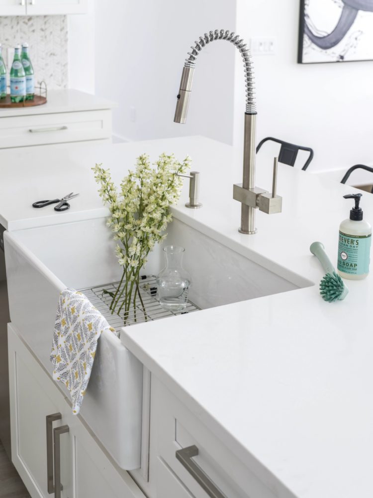 Close up view of Mantra Omni Snow farmhouse sink base