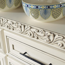 traditional decorative embellishment acanthus insert moulding on off white cabinets