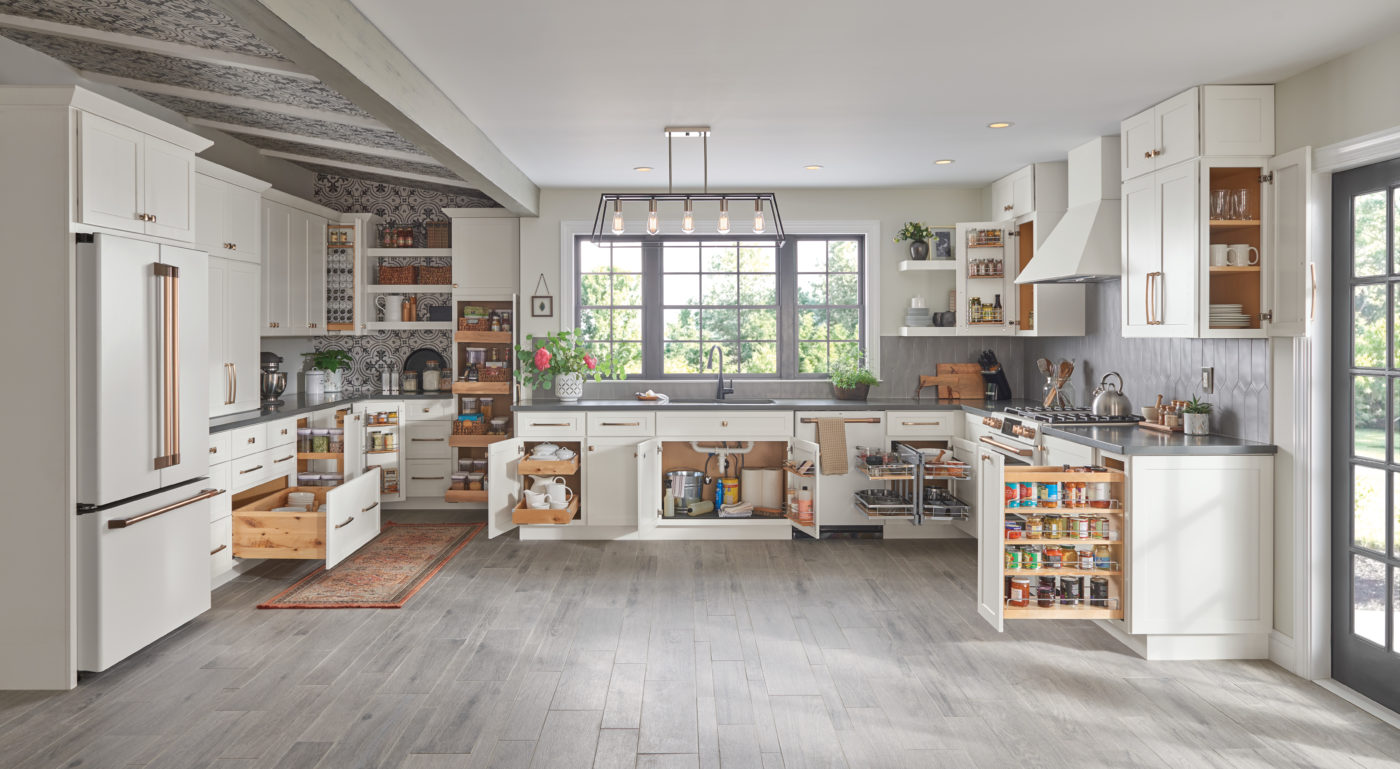 Large white kitchen with open storage and organization pulled out to show the impact.